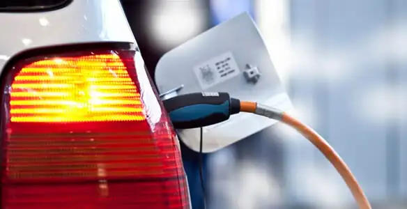 Electric car plugged into EV charger after professional installation in Atlanta, GA