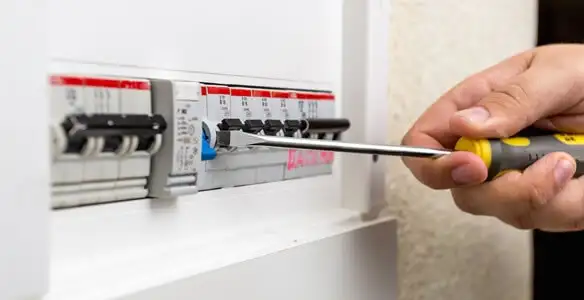 electrical panel upgrade service showing technician adjusting circuit breakers during system upgrade in Atlanta, GA