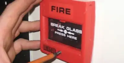 fire alarm installation service showing manual fire alarm pull station installed by licensed electricians in Atlanta, GA
