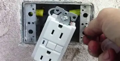 gfci circuits service showing installation of a ground fault circuit interrupter outlet by licensed electricians in Atlanta, GA