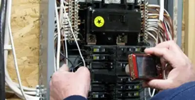 Home electrical inspection of circuit breaker panel by licensed electrician in Atlanta, GA