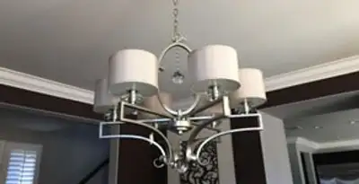 Modern chandelier installation with multiple light fixtures in Atlanta, GA
