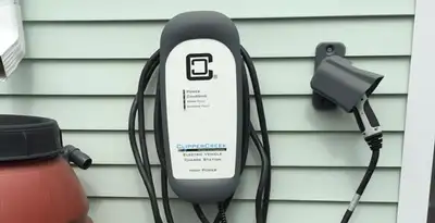 Outdoor electric vehicle charger installation on residential wall in Atlanta, GA