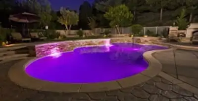 pool light installation and repair services illuminating a residential swimming pool in Atlanta, GA