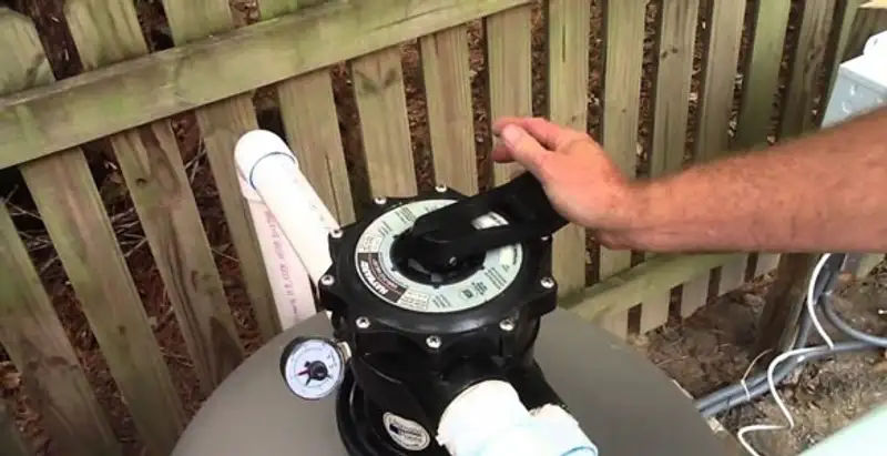 pool pumps service showing professional adjustment of pool pump control system in Atlanta, GA