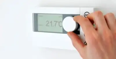 Thermostat installation service with professional adjusting temperature control in Atlanta, GA