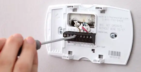 Thermostat installation service with proper wiring and secure wall mounting in Atlanta, GA